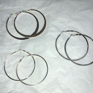 Three pair silver hoop earrings. 3”, 2.5”, 2.25”